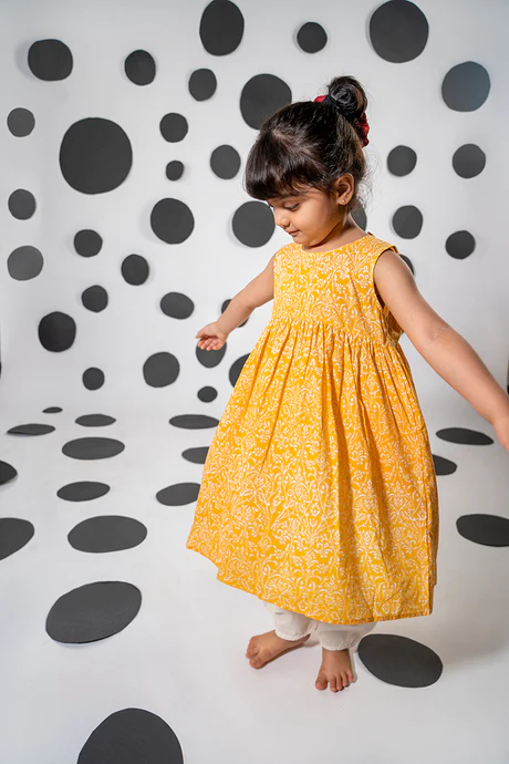 Set of 2- 'Love, share and care' yellow cotton kurta with floral hand block-print with white dhoti pant