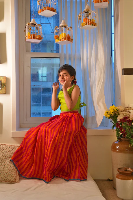 Palash girls ethnic wear set with lime green choli and orange pink striped skirt in handwoven cotton silk