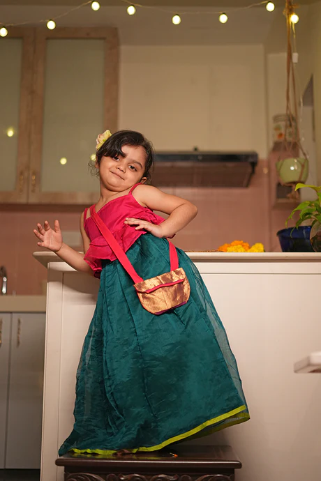 Dahlia girls ethnic wear set with pink blouse and green lehenga skirt in handwoven cotton silk with an upcycled handmade bag