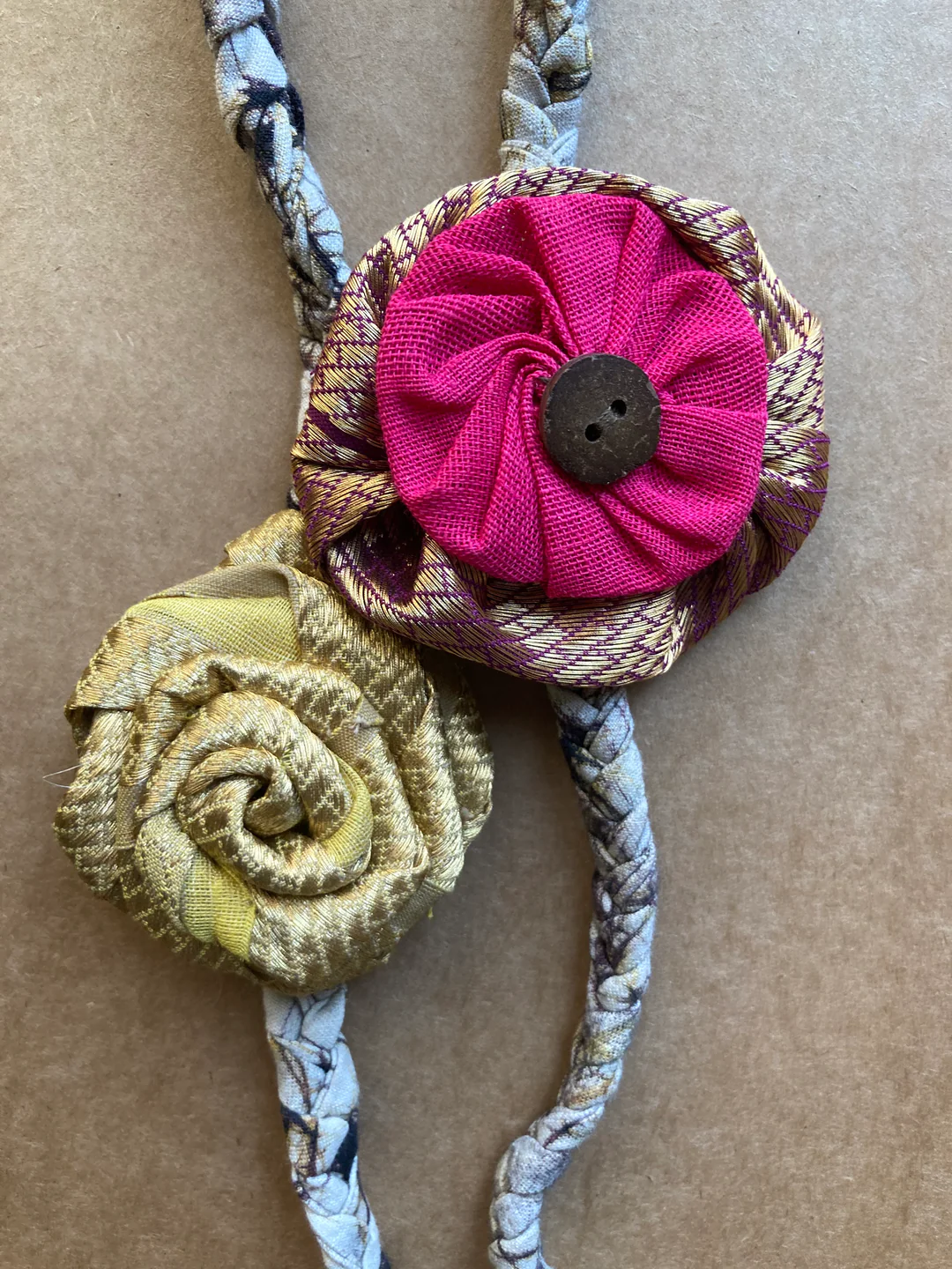Redefining sibling love - Yellow gold rose batik band with pink rakhi (Set of 2)