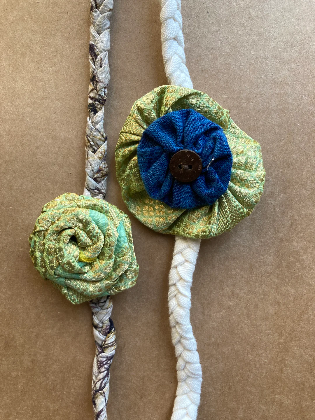 Redefining sibling love - Sea green gold rose batik band with blue rakhi (Set of 2)