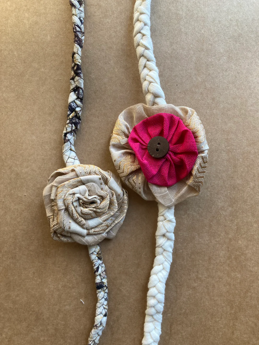 Redefining sibling love - Beige gold rose batik band with pink rakhi (Set of 2)